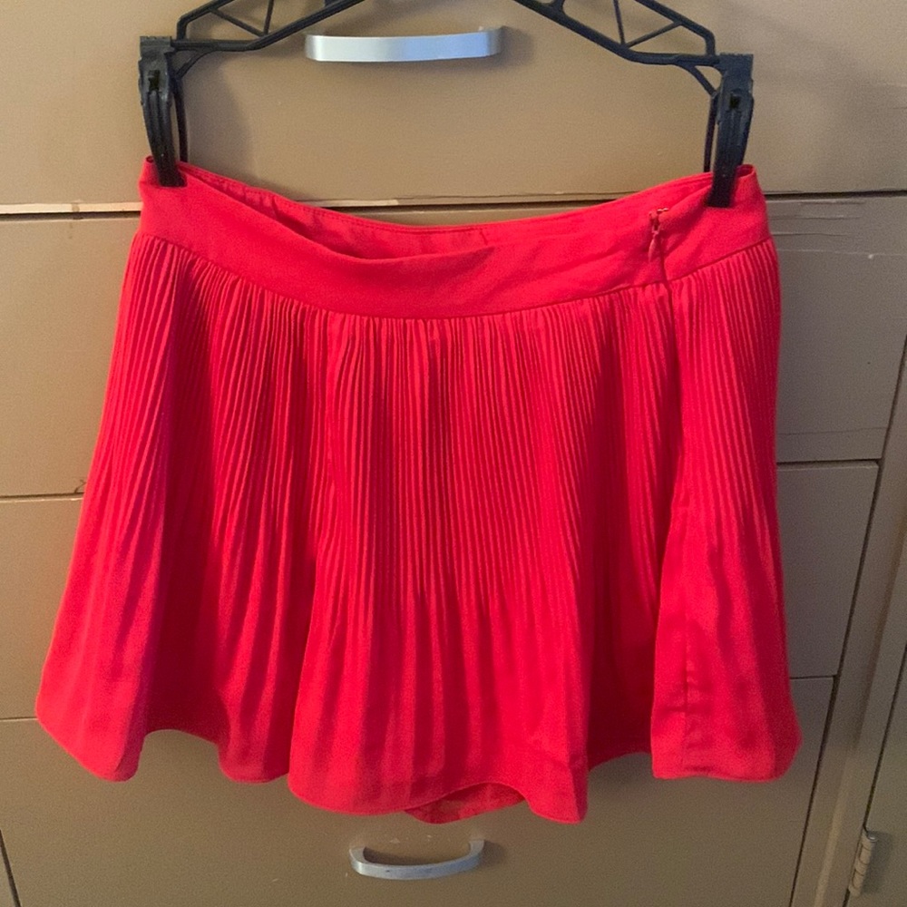 Red pleated mini skirt